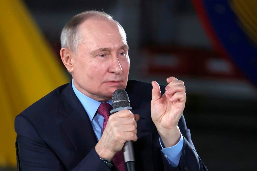 Russian President Vladimir Putin speaks to students and employees of the Chelyabinsk Forge-and-Press Plant in Chelyabinsk, Russia, Friday, Feb. 16, 2024. (Alexander Ryumin, Sputnik, Kremlin Pool Photo via AP)