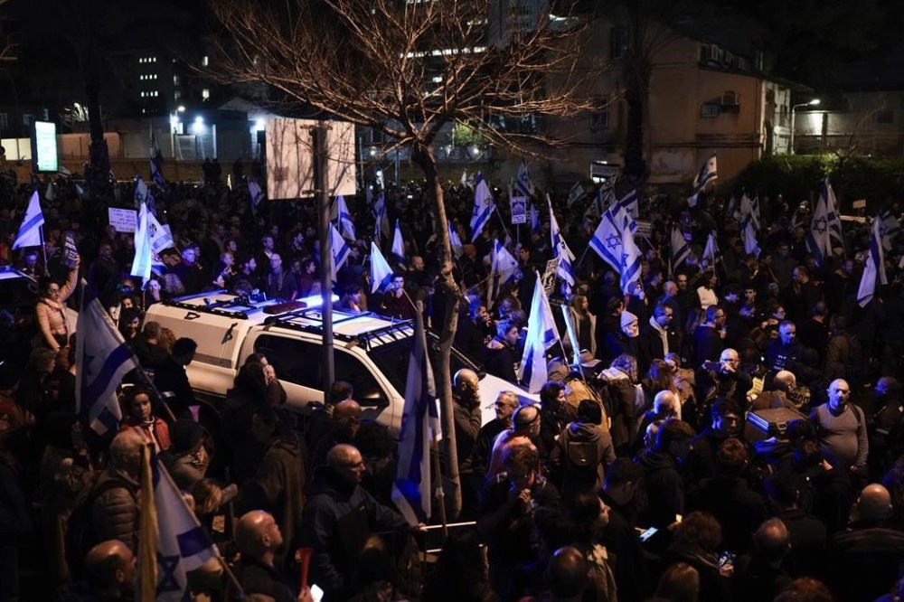 Demonstrators protest against Israeli Prime Minister Benjamin Netanyahu and call for new elections in the latest weekly protest against his handling of the Israel-Hamas war, in Tel Aviv, Israel, Saturday, Feb. 17, 2024.(AP Photo/Leo Correa)
