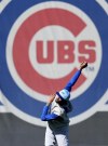 Chicago Cubs' Carl Edwards Jr. stretches during a baseball spring training workout, Saturday, Feb. 17, 2024, in Mesa, Ariz. (AP Photo/Matt York)