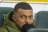 PSG's Kylian Mbappe looks out from the bench before the French League One soccer match between Nantes and Paris Saint-Germain at the Stade de la Beaujoire in Nantes, France, Saturday, Feb. 17, 2024. (AP Photo/Mathieu Pattier)