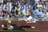 Bologna goalkeeper Lucasz Skorupski, left, and Lazio's Taty Castellanos in action during the Serie A soccer match between Lazio Roma and Bologna FC at the Stadio Olimpico di Roma in Rome, Italy, Sunday Feb. 18, 2024. (Alfredo Falcone/LaPresse via AP)