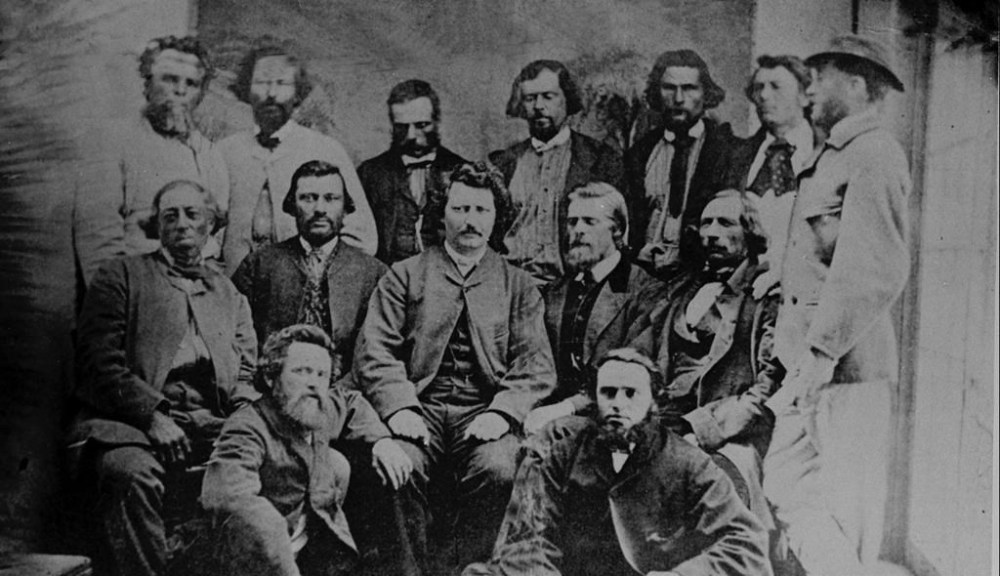 A portrait of Louis Riel hanging in the provincial legislature now recognizes the Métis leader as Manitoba's first premier. Riel - Riel and his Councillors, 1869-1870. Front: Bob O'Lane and Paul Proulx; seated: Pierre Poitras, John Bruce, Louis Riel, W.B. O'Donoghue, Franeois Dauphinais; standing Le Roc, Pierre Delorme, Thomas Bunn, Xavier Page, Andre Beauchemin, Baptiste Tereaux and Thomas Spence (National Archives of Canada/William James Topley)