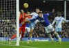 Everton's Ben Godfrey, front right, attempts a header on goal during the English Premier League soccer match between Everton and Crystal Palace at the Goodison Park stadium, in Liverpool, England, Monday, Feb. 19, 2024. (Peter Byrne/PA via AP)