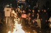 People burn torches after a march demanding the immediate release of the Israeli hostages held in the Gaza Strip by the Hamas militant group, in Jerusalem, Monday, Feb. 19, 2024. (AP Photo/Leo Correa)