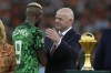 Nigeria's Victor Osimhen is greeted by FIFA President Gianni Infantino during the presentation Jeremy after the African Cup of Nations final soccer match between Ivory Coast and Nigeria, at the Olympic Stadium of Ebimpe in Abidjan, Ivory Coast, Sunday, Feb. 11, 2024. (AP Photo/Themba Hadebe)