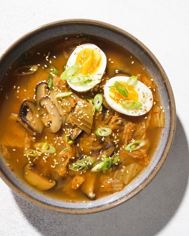 This image released by Milk Street shows a recipe for Miso, Shiitake Mushroom and Kimchi Soup. (Milk Street via AP)