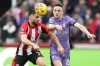 Liverpool's Diogo Jota vies for the ball with Brentford's Neal Maupay during the English Premier League soccer match between Brentford and Liverpool at the Gtech Community Stadium in London, Saturday, Feb. 17, 2024. (AP Photo/Kirsty Wigglesworth)