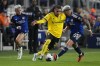 FC Cincinnati midfielders Álvaro Barreal (31) and Júnior Moreno (93) battle for the ball with Columbus Crew defender Mohamed Farsi (23) during the first half of an MLS Eastern Conference final soccer match, Saturday, Dec. 2, 2023, in Cincinnati. The Columbus Crew have signed Canadian wingback Farsi to a contract extension through the 2027 season with a club option for 2028. THE CANADIAN PRESS/AP/Carolyn Kaster
