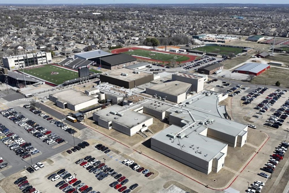 Owasso High School is seen on Tuesday, Feb. 20, 2024 in Owasso, Okla. Police are investigating the death of a 16-year-old student who died after being involved in a fight with other students inside the high school bathroom. (Mike Simons/Tulsa World via AP)