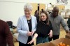 Finance Minister Katrine Conroy, left, is joined by food security co-ordinator Jesse Wallis and volunteer Vincent Aigbefo as they pack groceries for a subscription-based program made up of volunteers called Good Food Box during a photo opportunity at the Fernwood Community Centre in Victoria, B.C., on Wednesday, February 21, 2024. THE CANADIAN PRESS/Chad Hipolito