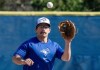 Toronto Blue Jays Davis Schneider fields a ball in Spring Training action in Dunedin, Fla. on Wednesday, February 21, 2024. Schneider is getting his first taste of big-league training camp even though he's no longer a rookie. THE CANADIAN PRESS/Frank Gunn