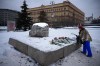 Woman lay flowers to pay tribute to Alexei Navalny at a monument outside the historical Federal Security Service building in Moscow, Wednesday, Feb. 21, 2024. Canada summoned the Kremlin's ambassador in Ottawa today to express its strong condemnation over Navalny's reported death in Russian custody. THE CANADIAN PRESS/AP-Alexander Zemlianichenko