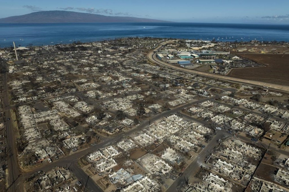 FILE - The aftermath of a wildfire is visible in Lahaina, Hawaii, Aug. 17, 2023. Hawaii Gov. Josh Green's administration had budgeted $199 million for Maui wildfire recovery expenses but are now expecting they may need $561 million under a “worst-case” scenario, the Honolulu Star-Advertiser reported Wednesday, Feb. 21, 2024. (AP Photo/Jae C. Hong, File)