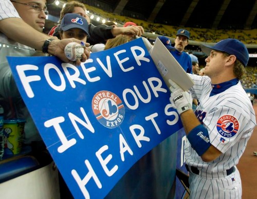 Montreal Expos first baseman Brad Wilkerson signs autographs before the team's final home game in Montreal Wednesday, Sept. 29, 2004. Streaming service Netflix announced Wednesday that a new documentary about the MLB's Expos and their departure from Montreal will be coming to the platform. THE CANADIAN PRESS/Ryan Remiorz