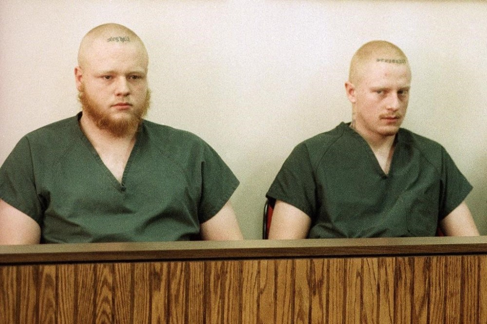 FILE - David Freeman, left, and Bryan Freeman, right, sit with Nelson Birdwell III, not pictured, as they appear in a Midland, Mich., courtroom, March 2, 1995. On Wednesday, Feb. 21, 2024, the two eastern Pennsylvania brothers sentenced to life in the slayings of their parents and younger brother almost three decades ago were resentenced to terms that may offer them a chance at parole. (AP Photo/Dale Atkins, File)