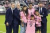 Inter Miami co-owner David Beckham, right, poses with Inter Miami forward Luis Suarez, second from right at rear, and his family before the team's MLS soccer match against Real Salt Lake, Wednesday, Feb. 21, 2024, in Fort Lauderdale, Fla. At left is Inter Miami co-owner Jose Mas, and second from left is manager owner Jorge Mas. (AP Photo/Lynne Sladky)