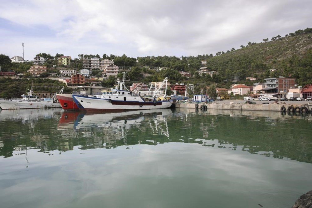 FILE - Vessels are docked at the port of Shengjin, northwestern Albania, one of two proposed places to house migrants, on Tuesday, Nov. 7, 2023. Albania's Assembly, or Parliament, votes on Thursday, Feb. 22, 2024, and is expected to approve a deal with Italy under which thousands of migrants rescued at sea by Italian authorities would be sent to Albania while their applications for asylum in Italy are processed. (AP Photo/Armando Babani, File)