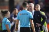 Real Madrid's head coach Carlo Ancelotti, right, talks with referee Alejandro Muniz Ruiz during the Spanish La Liga soccer match between Rayo Vallecano and Real Madrid at the Vallecas stadium in Madrid, Spain, Sunday, Feb. 18, 2024. (AP Photo/Manu Fernandez)