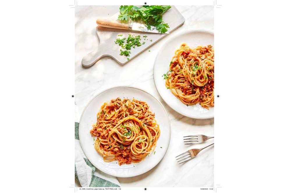 This image released by Yellow Kite shows a recipe for Spicy Sun-Dried Tomato and Eggplant Ragu from the cookbook “Healthy Made Simple” by Ella Mills. (Clare Winfield/ Yellow Kite via AP)