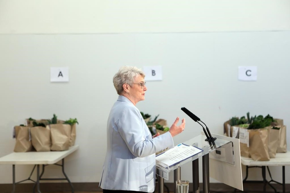 Finance Minister Katrine Conroy answers questions from reporters following a photo opportunity at the Fernwood Community Centre in Victoria, Wednesday, Feb. 21, 2024. THE CANADIAN PRESS/Chad Hipolito