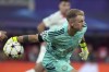 FILE - Celtic's goalkeeper Joe Hart holds the ball during the UEFA Champions League soccer match between RB Leipzig and Celtic FC Glasgow in Leipzig, Germany, Wednesday, Oct. 5, 2022. Celtic goalkeeper Joe Hart has announced he will retire after this season, ending a 20-year career that included 75 appearances for England. (AP Photo/Michael Sohn, File)