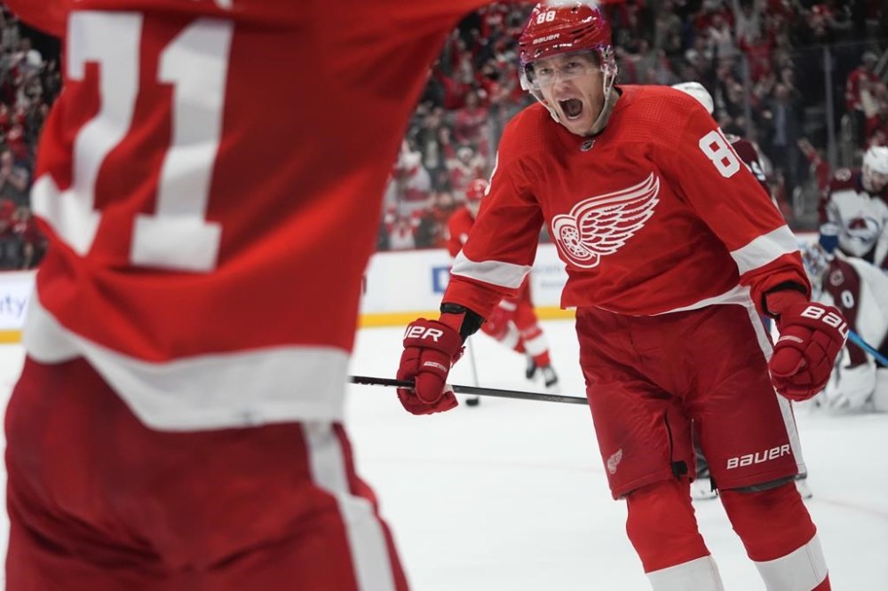 Detroit Red Wings right wing Patrick Kane (88) celebrates his goal against the Colorado Avalanche during overtime in an NHL hockey game Thursday, Feb. 22, 2024, in Detroit. (AP Photo/Paul Sancya)