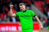 Leverkusen's goalkeeper Lukas Hradecky celebrates after the Bundesliga soccer match between 1. FC Heidenheim and Bayer 04 Leverkusen in Heidenheim, Germany, Saturday, Feb. 17, 2024. (Tom Weller/dpa via AP)