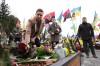 Ukrainian President Volodymyr Zelenskyy, Denmark's Prime Minister Mette Frederiksen, and her husband Bo Tengberg, center, lay wreaths during a memorial ceremony at the Field of Mars at Lychakiv Cemetery in Lviv, Ukraine, Friday Feb. 23, 2024. (Mads Claus Rasmussen/Ritzau Scanpix via AP)