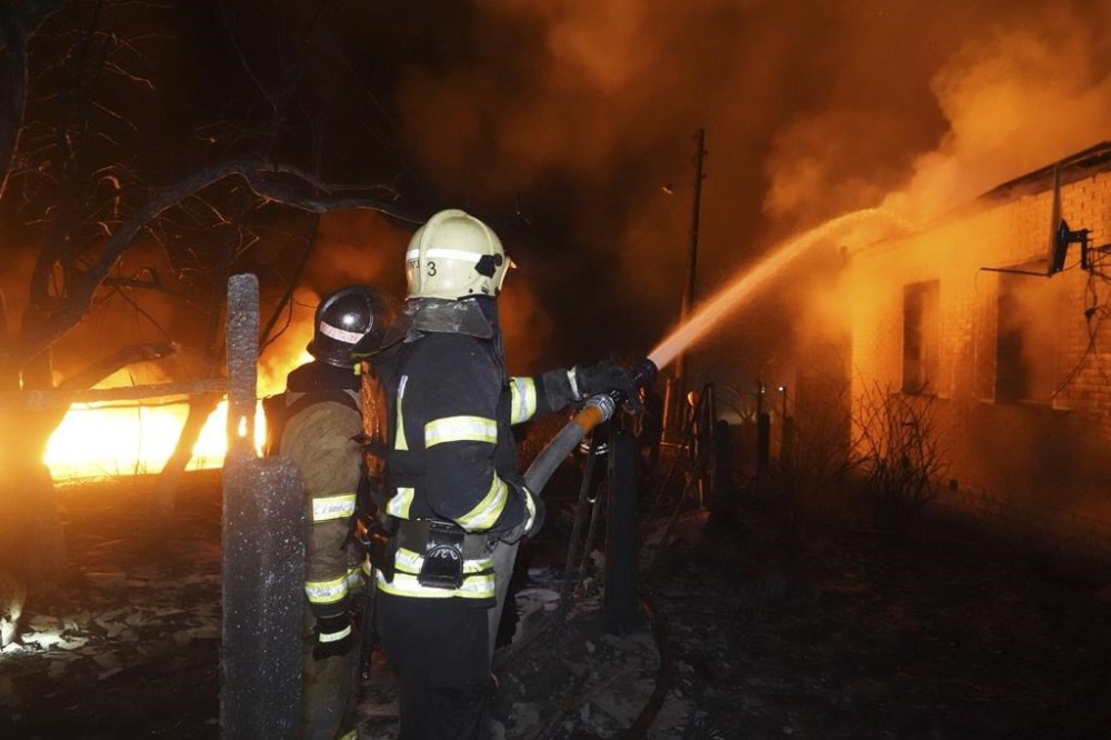 Canada is sanctioning 10 more people and 153 new Russian entities as the invasion in Ukraine is set to pass the second year mark this weekend. Firefighters extinguish a fire after a Russian attack on residential neighborhood in Kharkiv, Ukraine Saturday, Feb. 10, 2024. THE CANADIAN PRESS/AP-Andrii Marienko
