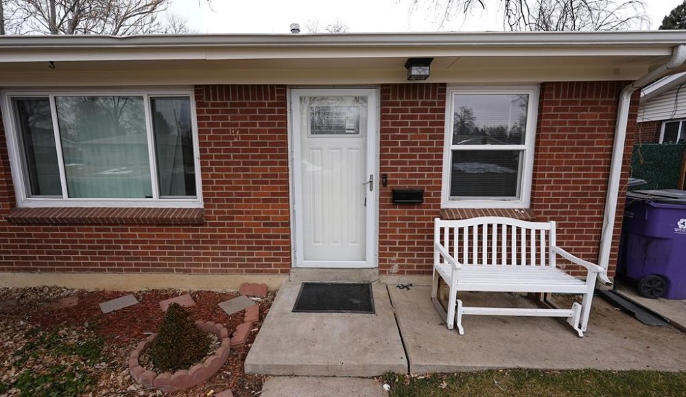 FILE - The residence where a former funeral home owner kept a deceased women's body in a hearse for two years as well as the remains of 30 cremated people is shown Friday, Feb. 16, 2024, in southwest Denver. Miles Harford, a former funeral home owner accused of hiding a woman's corpse in the back of a hearse for two years and hoarding the cremated remains of at least 30 people, was arrested Thursday night, Feb. 22, 2024, authorities said. (AP Photo/David Zalubowski, File(