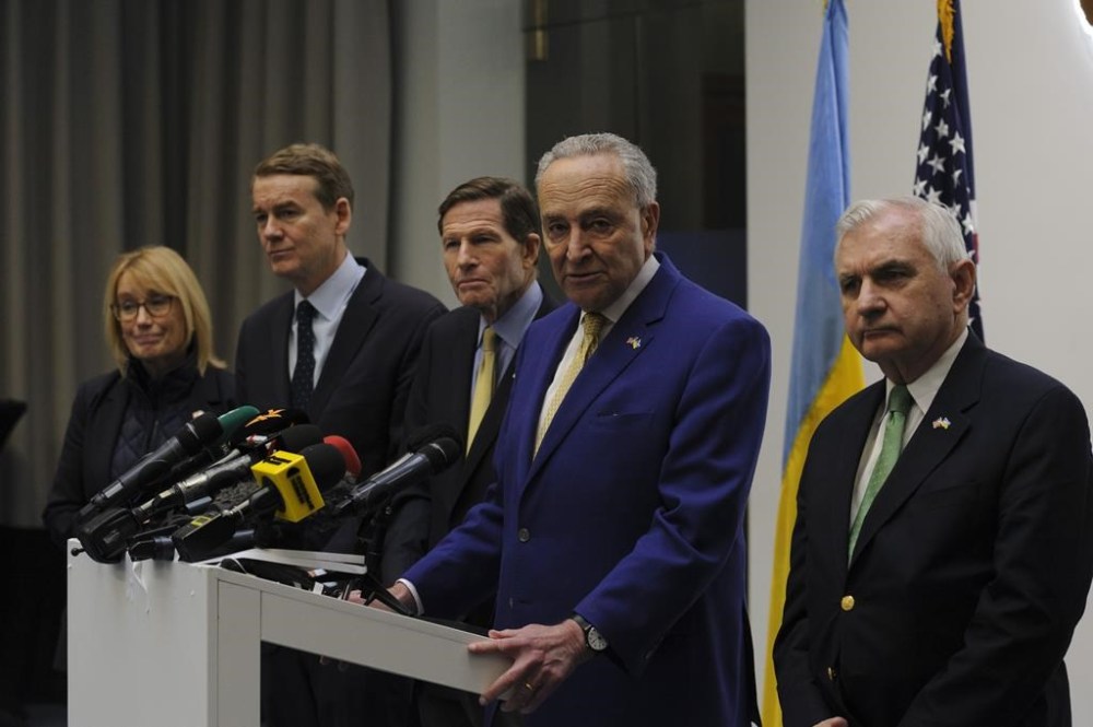Left to right: Sen. Maggie Hassan, D-N.H., Sen. Michael Bennet, D-Colo., Sen. Richard Blumenthal., D-Conn., Charles Schumer, D-N.Y. and Sen. Jack Reed, D-R.I. answer media questions in Lviv, Ukraine, Friday, Feb. 23, 2024. (AP Photo/Mykola Tys)