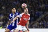Arsenal's Declan Rice heads the ball next to Porto's Evanilson during a Champions League round of 16 soccer match between FC Porto and Arsenal at the Dragao stadium in Porto, Portugal, Wednesday, Feb. 21, 2024. (AP Photo/Luis Vieira)
