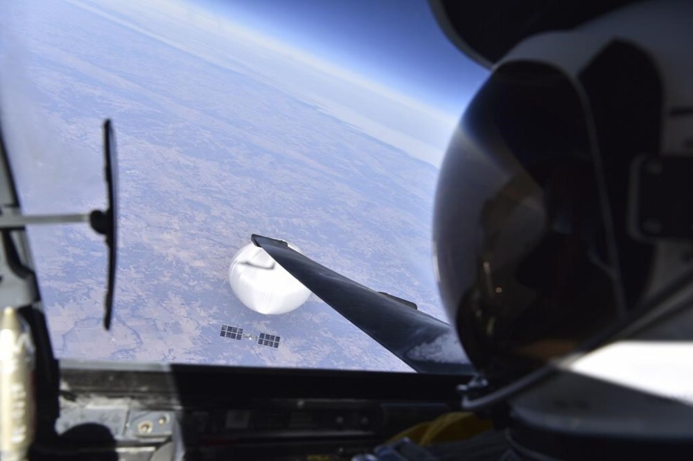 FILE - In this image provided by the Department of Defense, Wednesday, Feb. 22, 2023, a U.S. Air Force U-2 pilot looks down at a suspected Chinese surveillance balloon as it hovers over the United States on Feb. 3, 2023. A small and nonthreatening balloon spotted flying high over the mountainous Western United States was intercepted by fighter jets over Utah, Friday, Feb. 23, 2024, according to the North American Aerospace Defense Command. (Department of Defense via AP, File)