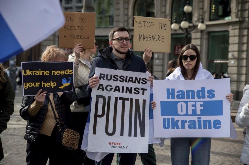 Russian and Ukrainian citizens gather in memory of Alexei Navalny in Milan, Itlay, Saturday Feb. 24, 2024. (Claudio Furlan/LaPresse via AP)