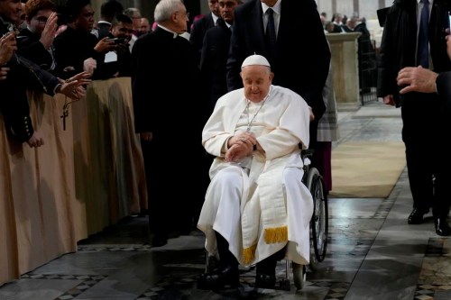 Pope Francis leaves after presiding over the liturgy of the ashes in the Basilica of Santa Sabina in Rome on Ash Wednesday, Feb. 14, 2024. (AP Photo/Gregorio Borgia)
