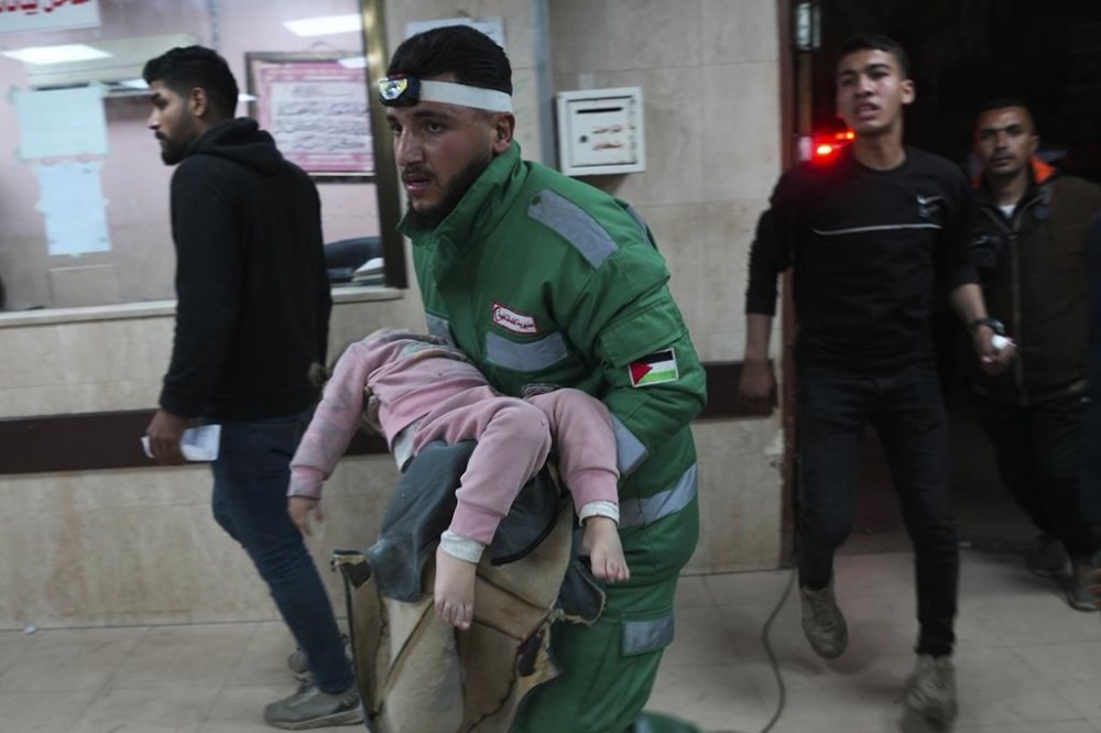 Palestinians wounded in the Israeli bombardment of the Gaza Strip are brought to Al Aqsa hospital in Deir al Balah, Friday, Feb. 23, 2024. (AP Photo/Adel Hana)