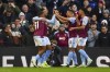 Aston Villa's Leon Bailey, left, celebrates after scoring his side's fourth goal during the English Premier League soccer match between Aston Villa and Nottingham Forest at the Villa Park stadium in Birmingham, England, Saturday, Feb. 24, 2024. (AP Photo/Rui Vieira)