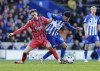 Everton's James Garner, left, and Brighton and Hove Albion's Facundo Buonanotte battle for the ball during the Serie A soccer match between Sassuolo and Empoli at Mapei Stadium, Reggio Emilia, Italy, Saturday Feb. 24, 2024. (Massimo Paolone/LaPresse via AP)