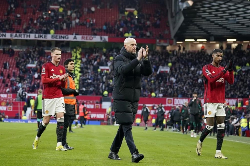 Manchester United's head coach Erik ten Hag applauds to supporters after the English Premier League soccer match between Manchester United and Fulham at Old Trafford stadium in Manchester, Saturday, Feb. 24, 2024.(AP Photo/Dave Thompson)