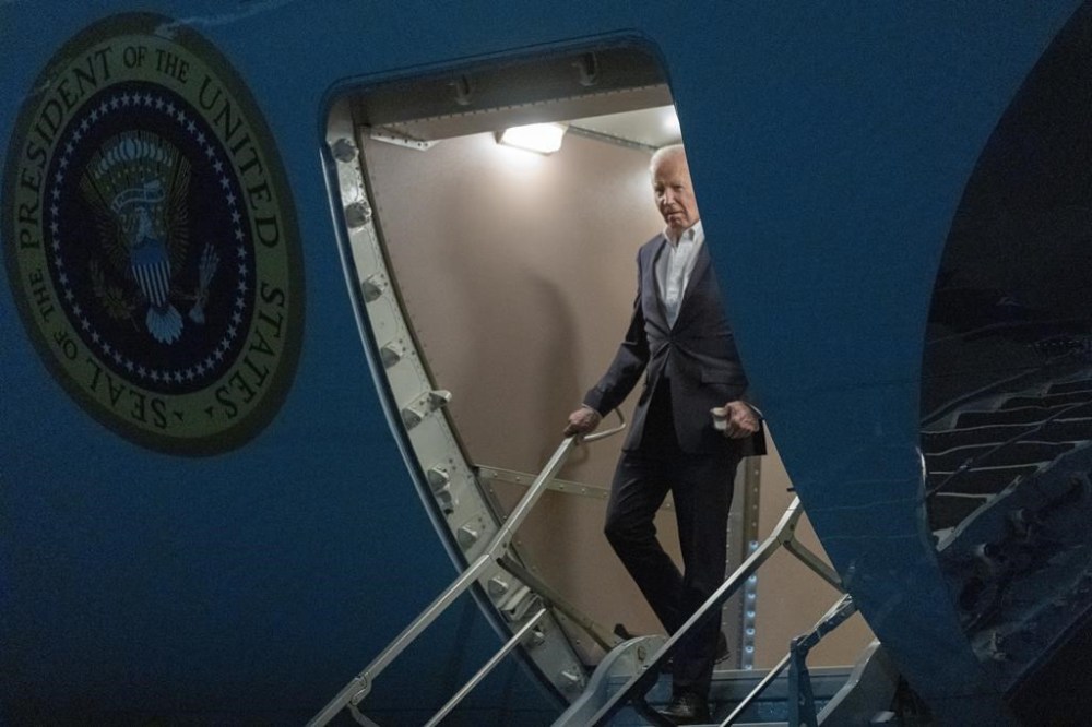 President Joe Biden walks down the ramp of Air Force One as he arrives at Andrews Air Force Base, Md., from a campaign and fundraising trip to California, late Thursday, Feb. 22, 2024. (AP Photo/Manuel Balce Ceneta)