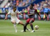 Toronto FC's Richie Laryea, right, loses the ball to FC Cincinnati's Yuya Kubo during the first half of a MLS soccer match in Cincinnati, Sunday, Feb. 25, 2024. THE CANADIAN PRESS/AP-Jeff Dean