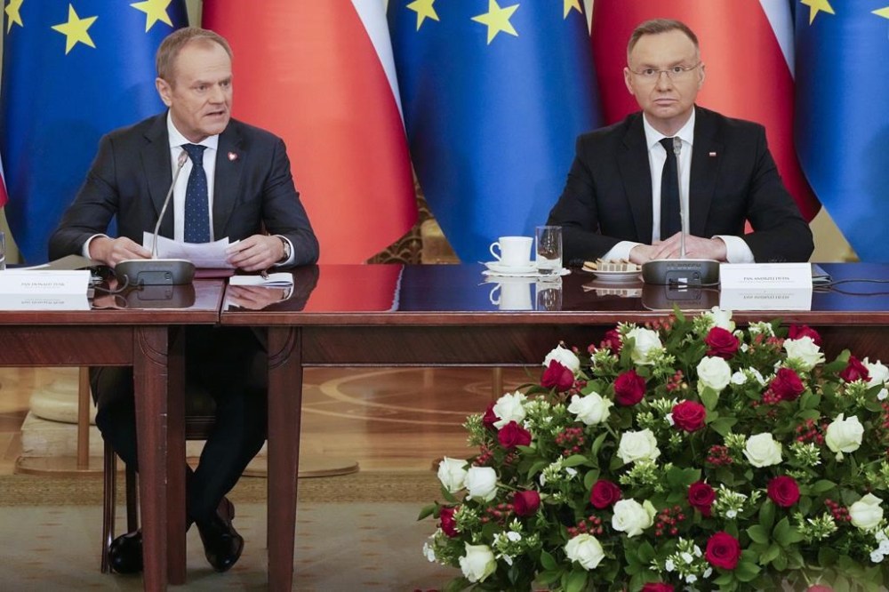 Poland's Prime Minister Donald Tusk, left, and President Andrzej Duda attend a meeting of the Cabinet Council, a consultation format between the president and the government in Warsaw, Poland on Tuesday Feb. 13, 2024. Prime Minister Justin Trudeau is visiting Presidential Palace in Warsaw for the first time since a political sea change in Poland ended eight years of national conservative rule. THE CANADIAN PRESS/AP-Czarek Sokolowski