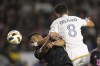 Los Angeles Galaxy midfielder Marco Delgado (8) and Inter Miami forward Luis Suárez (9) vie for the ball during the first half of an MLS soccer match, Saturday, Feb. 25, 2024, in Carson, Calif. (AP Photo/Kyusung Gong)