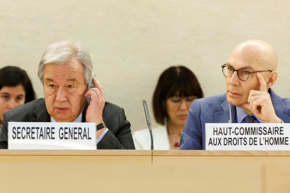 U.N. Secretary-General Antonio Guterres, left, and U.N. High Commissioner for Human Rights Volker Turk (Tuerk), right, listens to a speech, during the opening of the High-Level Segment of the 55th session of the Human Rights Council at the European headquarters of the United Nations in Geneva, Switzerland, Monday, Feb. 26, 2024. (Salvatore Di Nolfi/Keystone via AP)