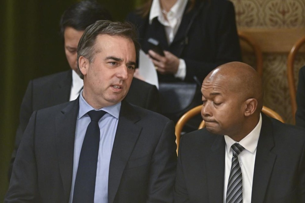 United States' David Pressman, left, waits before a vote by lawmakers which is expected to approve Sweden's accession into NATO, in Budapest, Hungary, Monday, Feb 26, 2024. Hungary's parliament holds a vote on ratifying Sweden's bid to join NATO bringing an end to more than 18 months of delays that have frustrated the alliance as it seeks to expand in response to Russia's war in Ukraine. (AP Photo/Denes Erdos)