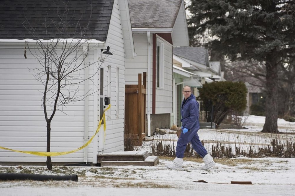 A judge has ordered a Manitoba man accused of killing five family members, including his three young children, undergo a mental health assessment to determine whether he is fit to stand trial. Forensic investigators work at the scene of an ongoing investigation regarding five deaths in southern Manitoba, in Carman, Man., Monday, Feb. 12, 2024. THE CANADIAN PRESS/David Lipnowski