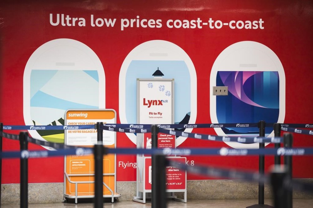 Lynx Air ceased to fly this week, the latest in a long line of discount carriers to bite the departures dust — brought down in part by stiff competition, high fees and Canada’s vast geography. Lynx Air signage is displayed at the John C. Munro Hamilton International Airport in Hamilton, Ont., Friday, February 23, 2024. THE CANADIAN PRESS/Nick Iwanyshyn