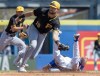 Pittsburgh Pirates second baseman Jared Triolo (19) snags the throw as Toronto Blue Jays Cam Eden slides into second base on a wild pitch during second inning Spring Training action in Dunedin, Fla. on Monday February 26, 2024. THE CANADIAN PRESS/Frank Gunn