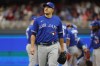 Toronto Blue Jays pitcher Erik Swanson walks to the dugout during a pitching change in the seventh inning of Game 2 of an AL wild-card baseball playoff series against the Minnesota Twins Wednesday, Oct. 4, 2023, in Minneapolis. Swanson will be away from the team indefinitely after his son was hit by a car and hospitalized on Sunday in Florida, manager John Schneider said. THE CANADIAN PRESS/AP-Bruce Kluckhohn