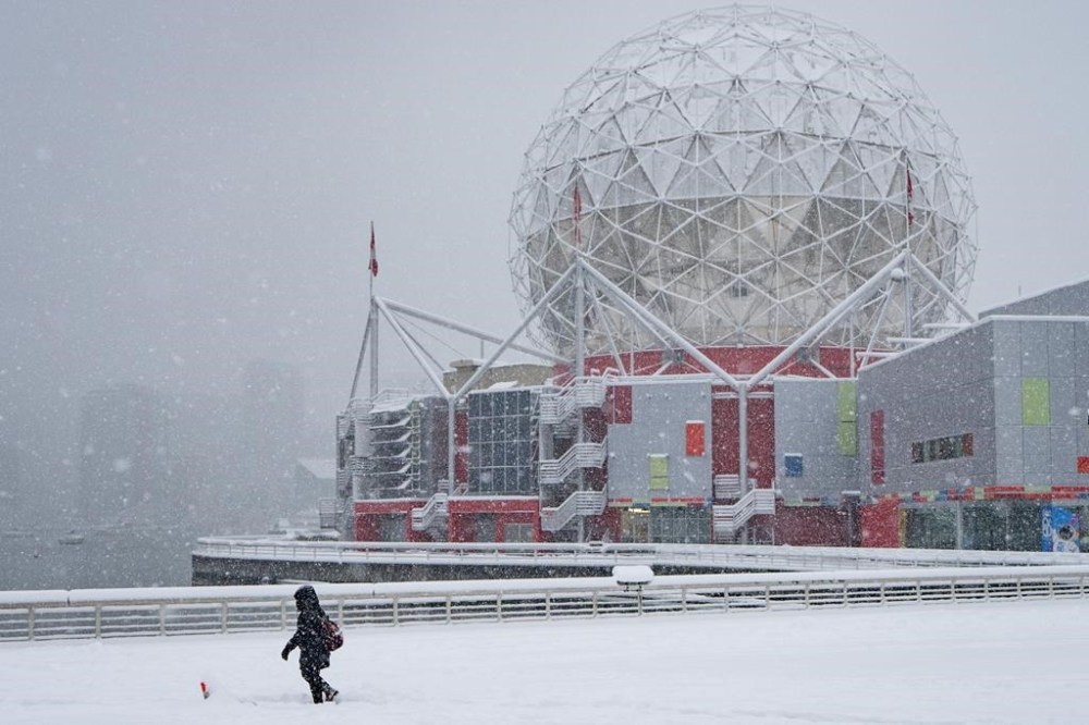 Environment Canada is warning of hazardous driving conditions on several stretches of British Columbia highways as a strong Pacific frontal system pushes into the province's Interior. A person walks through deep snow during a snowstorm in Vancouver Wednesday, Jan. 17, 2024. THE CANADIAN PRESS/Ethan Cairns